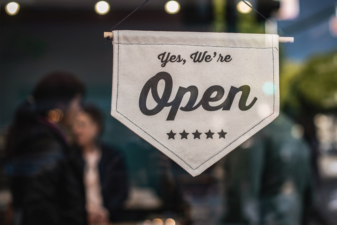 Small business storefront with open sign in window