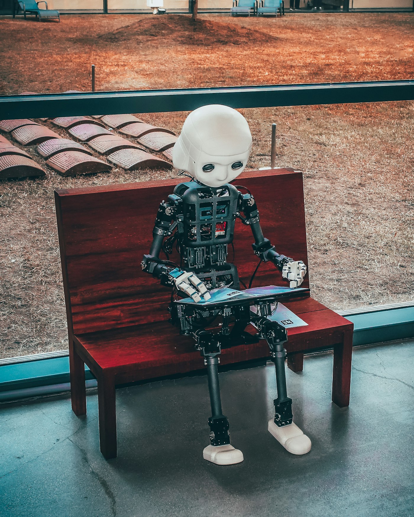 Robotic figure representing artificial intelligence on a clean background